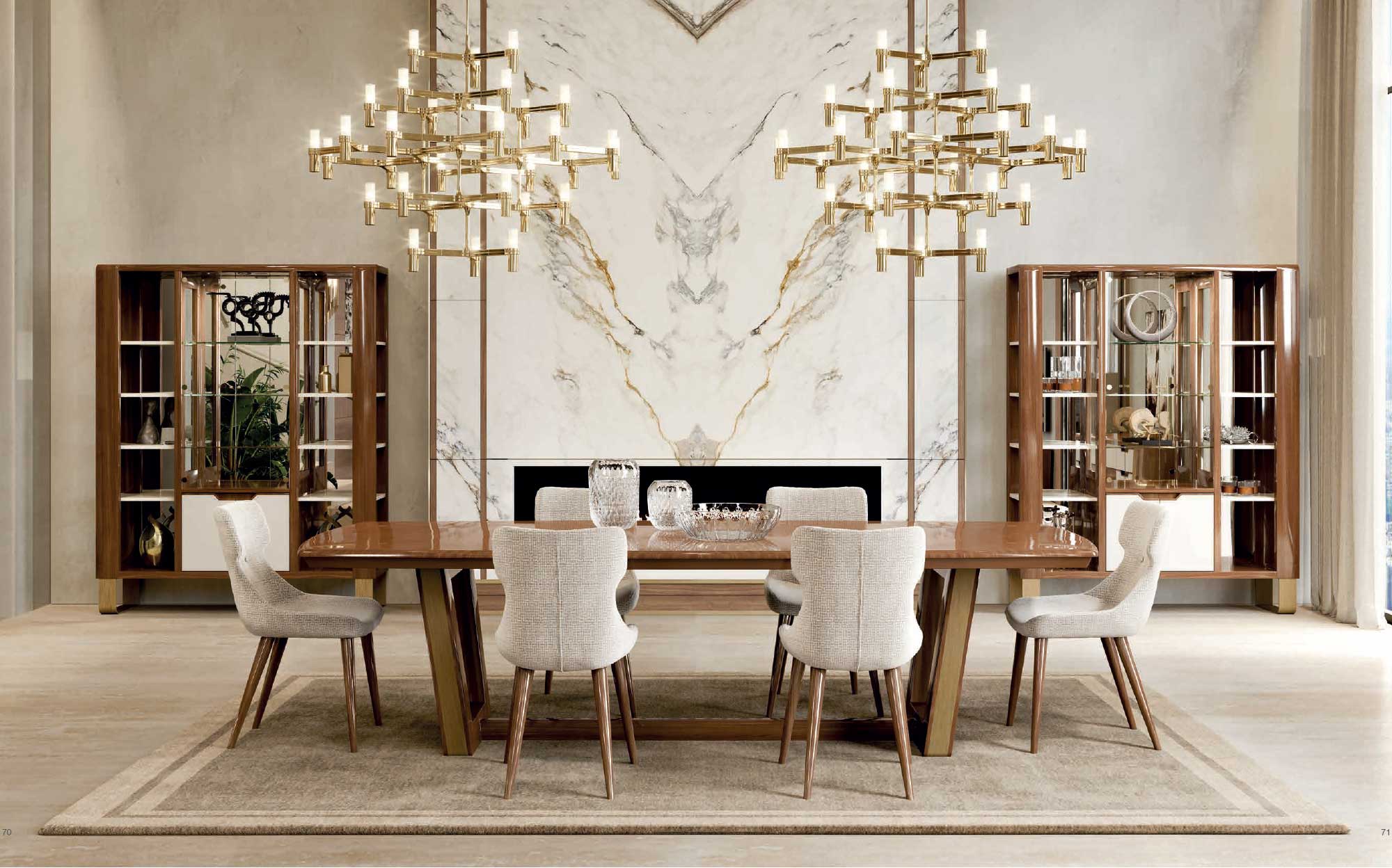 Elegant dining room from the Cloe collection by Ceppi featuring a Canaletto walnut dining table, upholstered chairs, display cabinets and designer chandeliers in a refined marble interior.