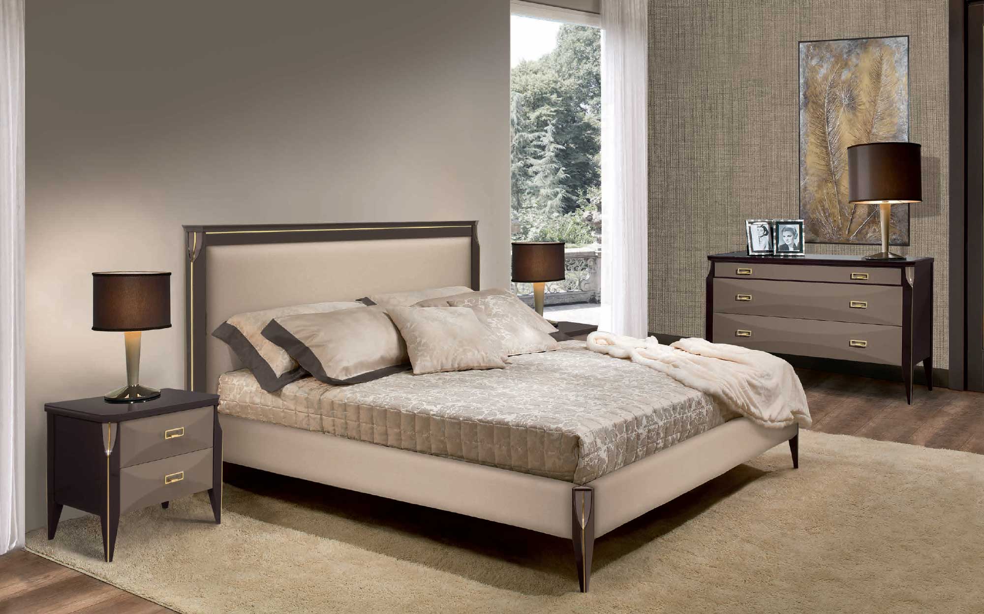 Refined bedroom from the Cloe collection by Ceppi featuring an upholstered bed, matching bedside tables and dresser with brass details, elegant luxury bedroom interior.