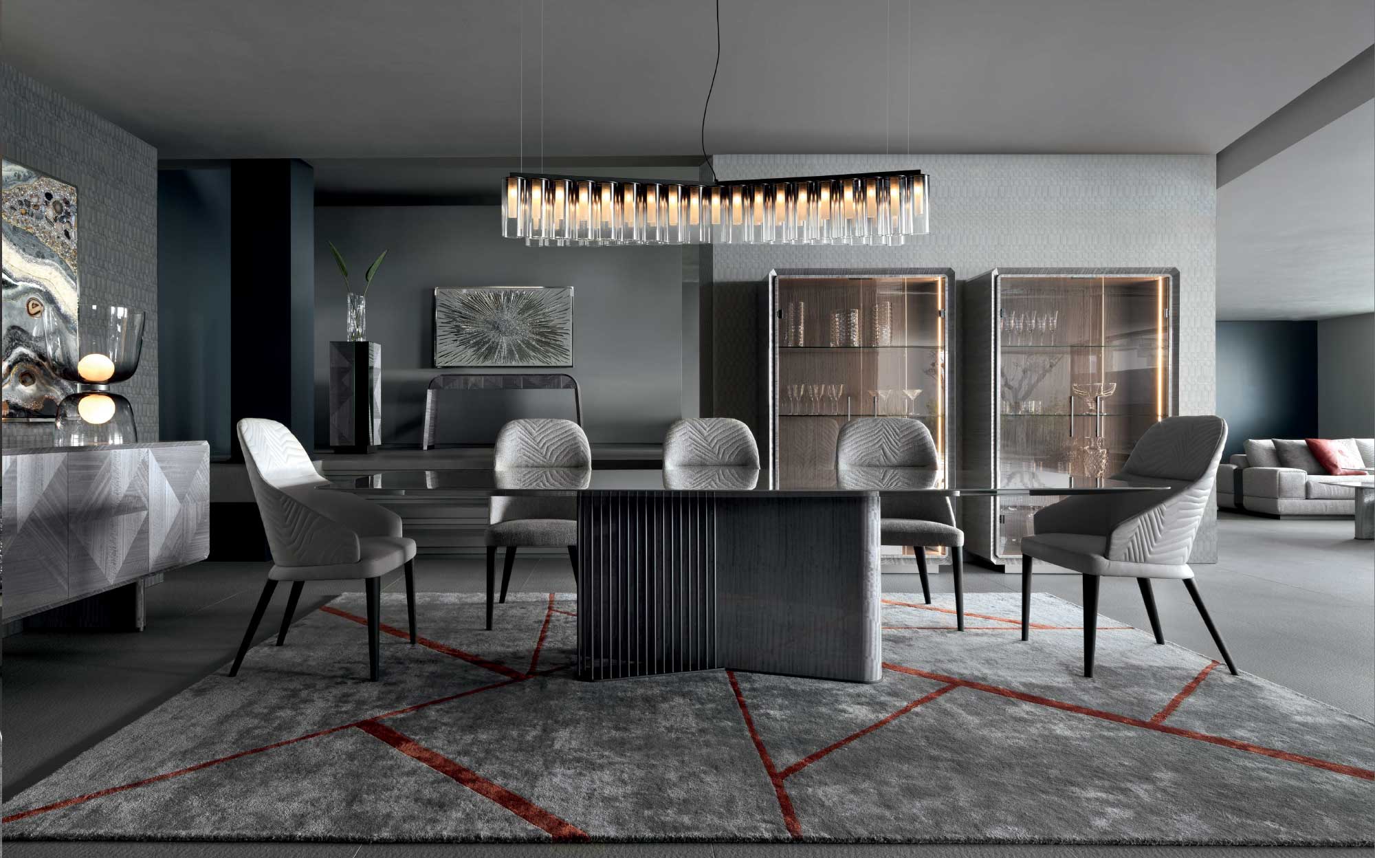 Elegant dining room with illuminated display cabinets and sophisticated design | 101DOMUS Modern dining room with glass table, grey upholstered chairs and illuminated display cabinets