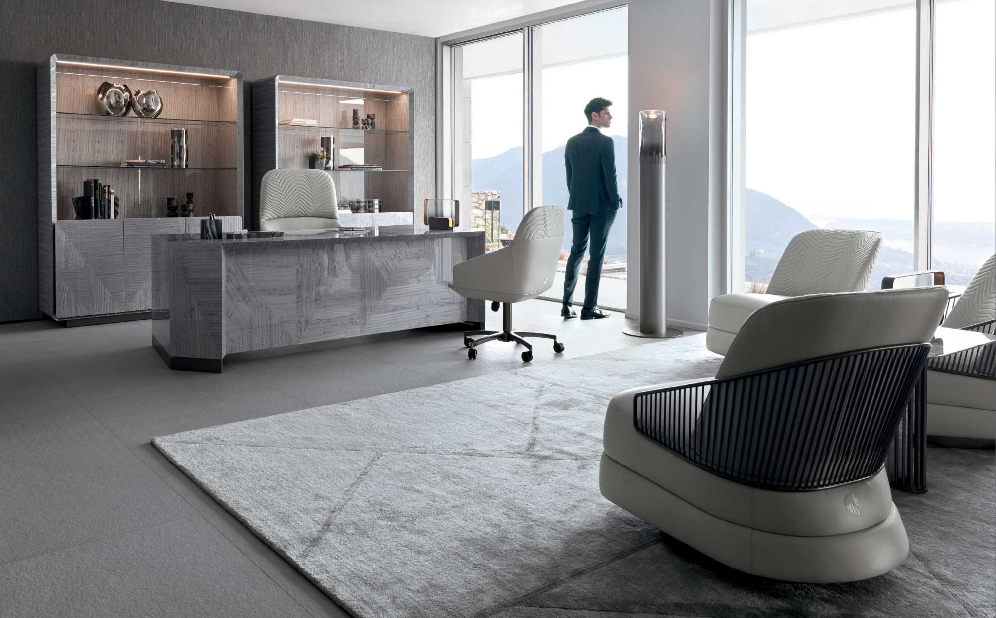 Luxury office furniture with grey geometric finish desk and shelving units | 101DOMUS Elegant office with glossy wood desk and modern armchairs