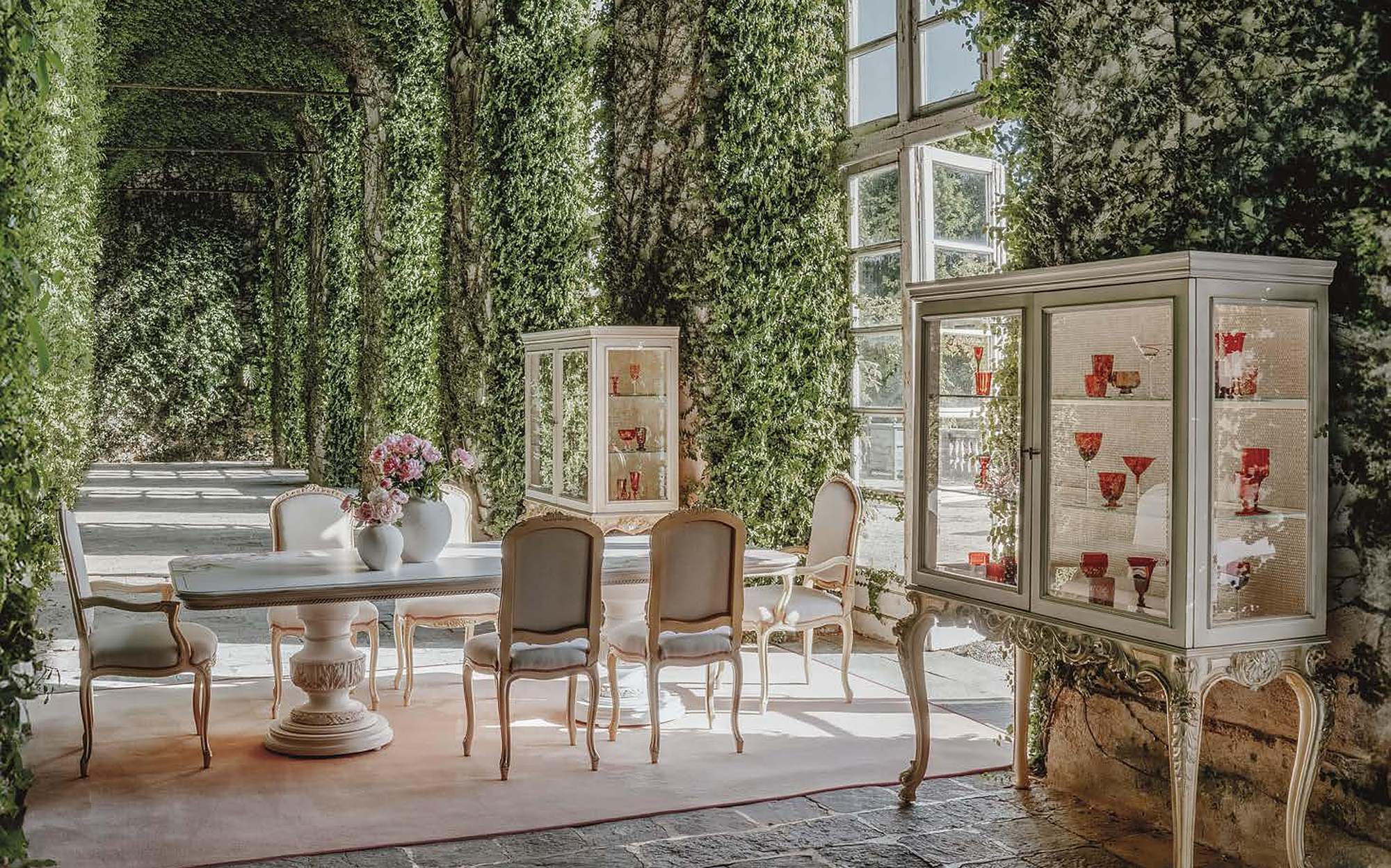Bellotti Ezio Cromie dining room with display cabinet and carved chairs in garden Bellotti Ezio Cromie dining room with display cabinet and carved chairs in garden – classic Italian luxury furniture