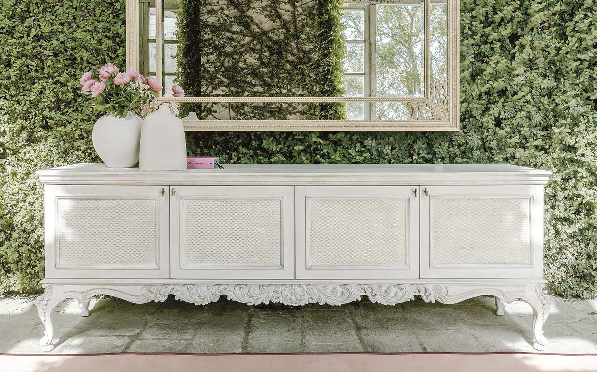 Bellotti Ezio Cromie sideboard with carved base and mirror in garden Bellotti Ezio Cromie sideboard with carved base and mirror in garden – classic Italian luxury furniture