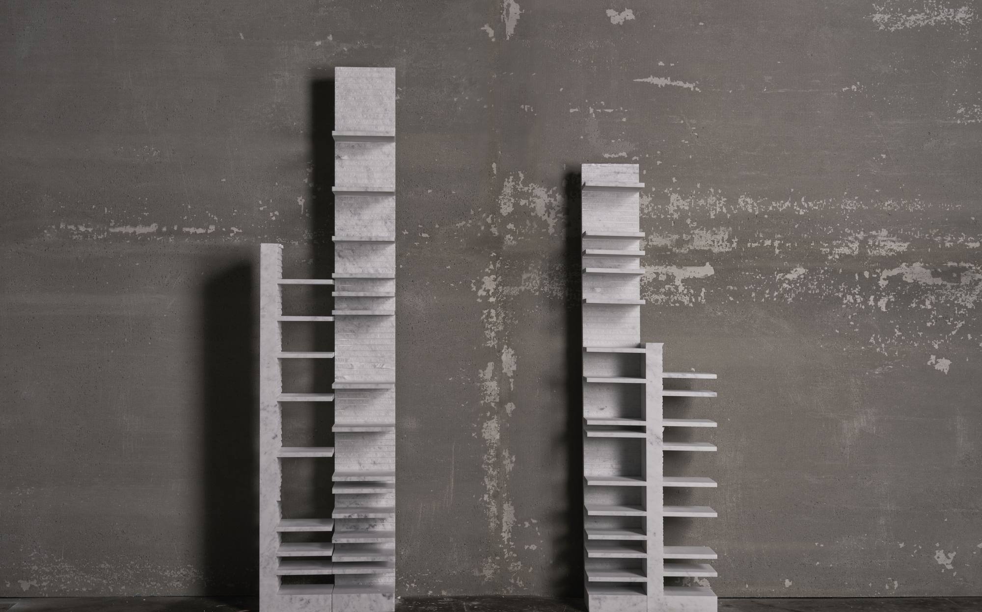Bufalini Arcaica white marble bookcases with layered shelves designed by Paolo Ulian