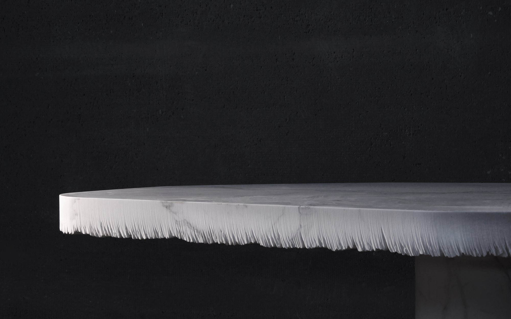 Bufalini luxury marble dining table with hand-split edge designed by Paolo Ulian