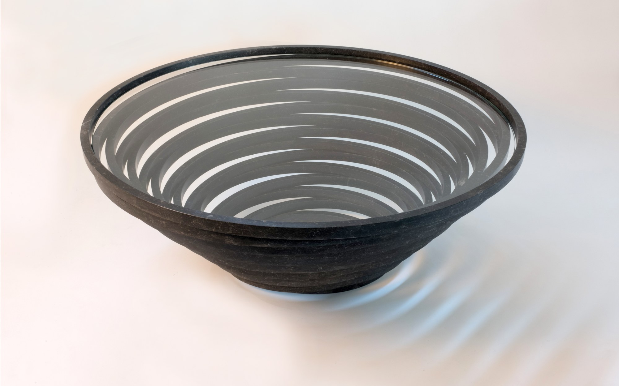 Bufalini black marble spiral-cut bowl designed by Paolo Ulian