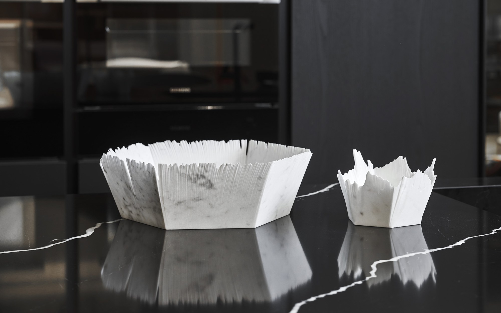 Bufalini white marble bowls with hand-broken edges designed by Paolo Ulian