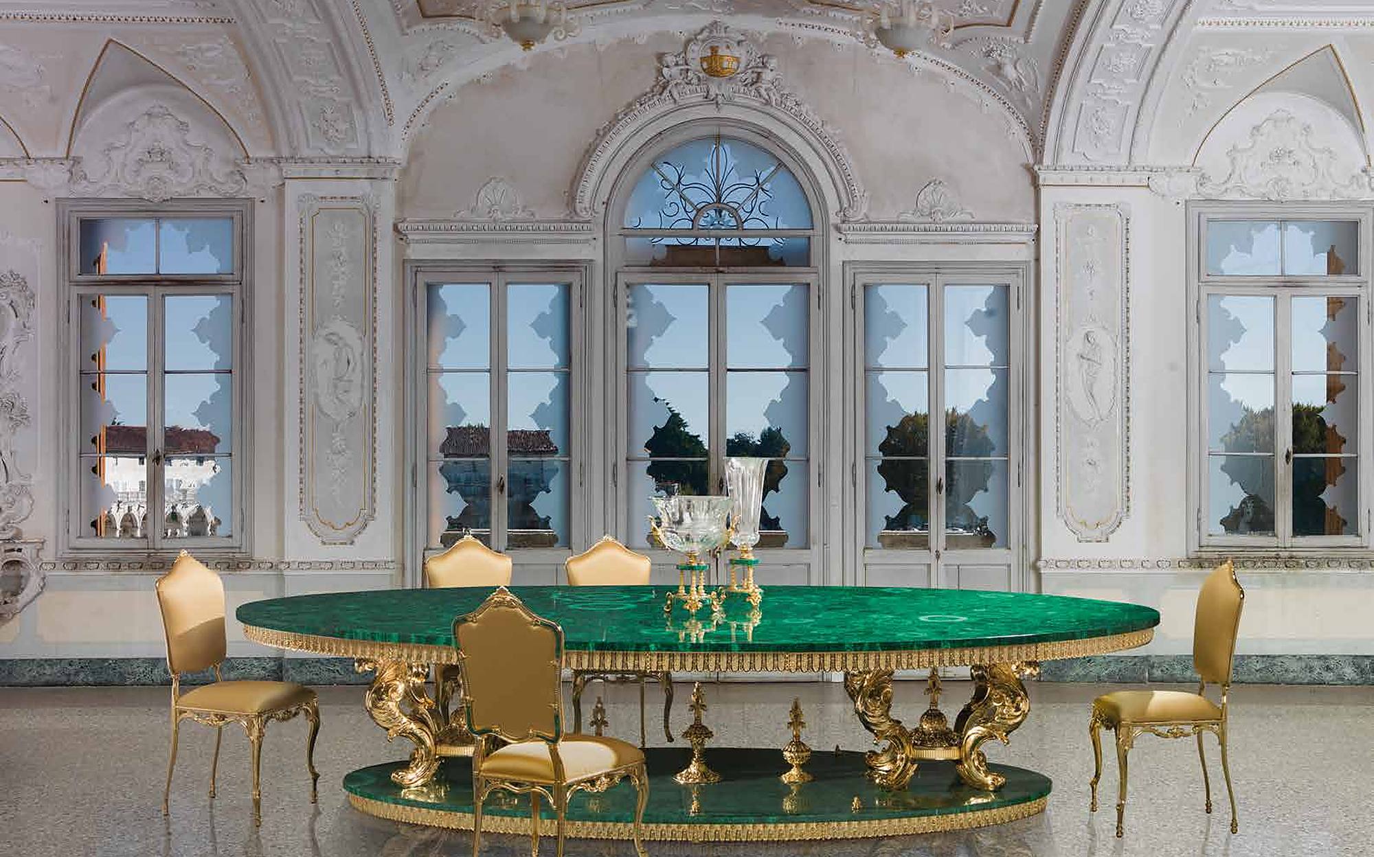 I Biagi Interiors malachite dining table with gold chairs in palace hall I Biagi Interiors malachite dining table with gold chairs in palace hall – Italian luxury furniture