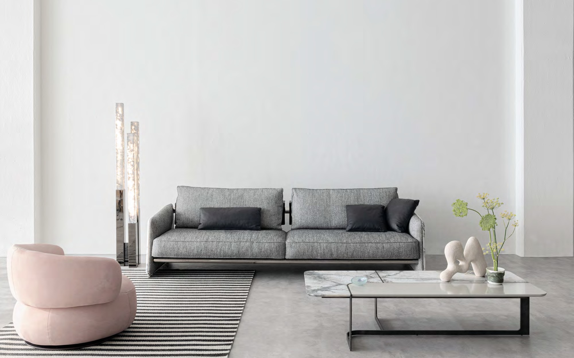 Lenzi Home Collection 2024 grey sofa with marble coffee table and pink armchair Lenzi Home Collection 2024 grey sofa with marble coffee table and pink armchair – Italian luxury furniture