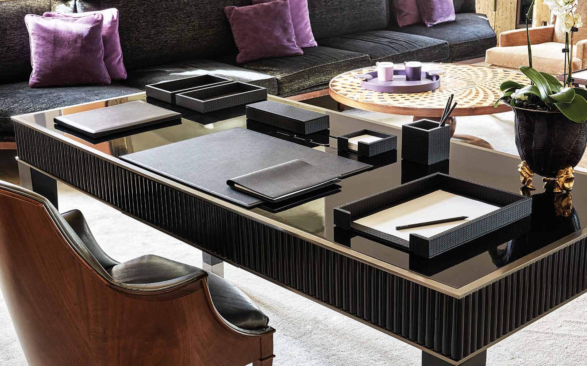 Pinetti Collection 2024 leather desk set on a black lacquered table Pinetti Collection 2024 leather desk set on a black lacquered table – Italian luxury leather accessories
