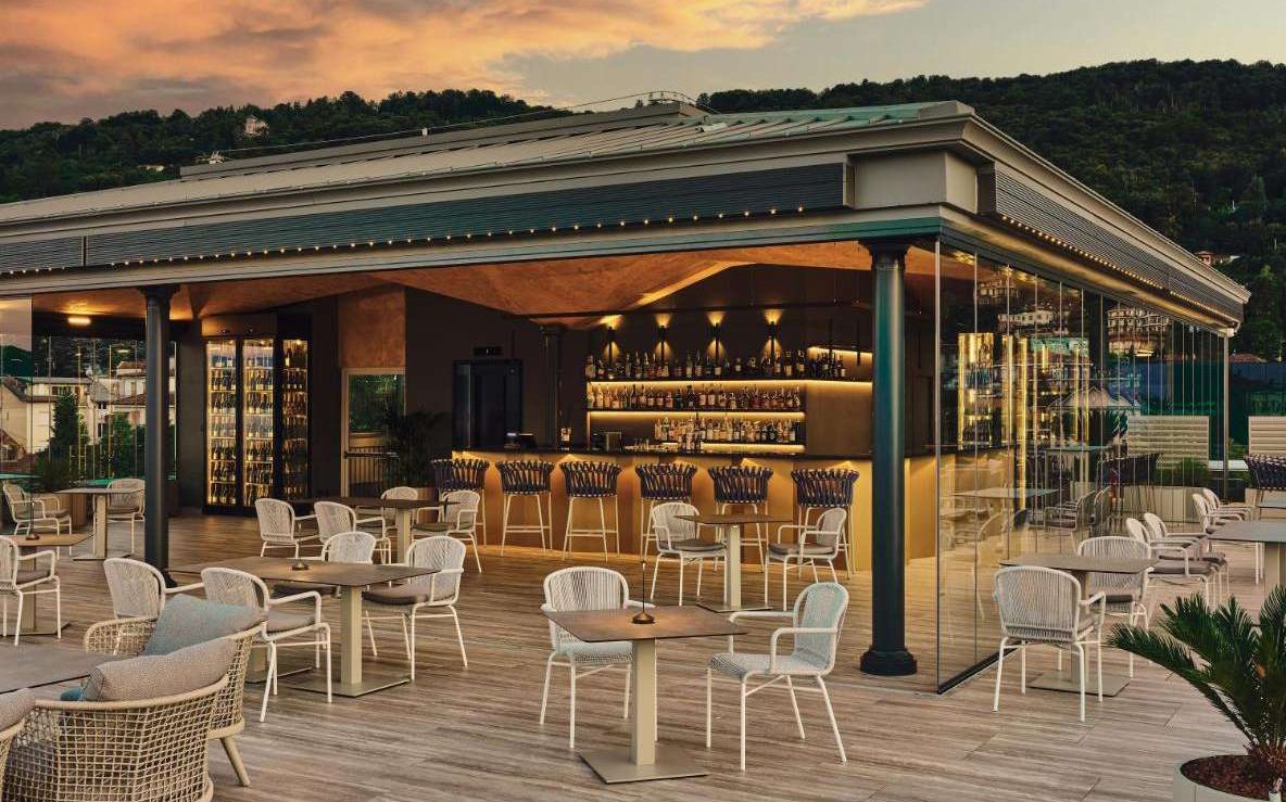 Terrace bar with lounge seating at sunset, Boutique Hotel Stresa, Francesco Molon project | 101domus