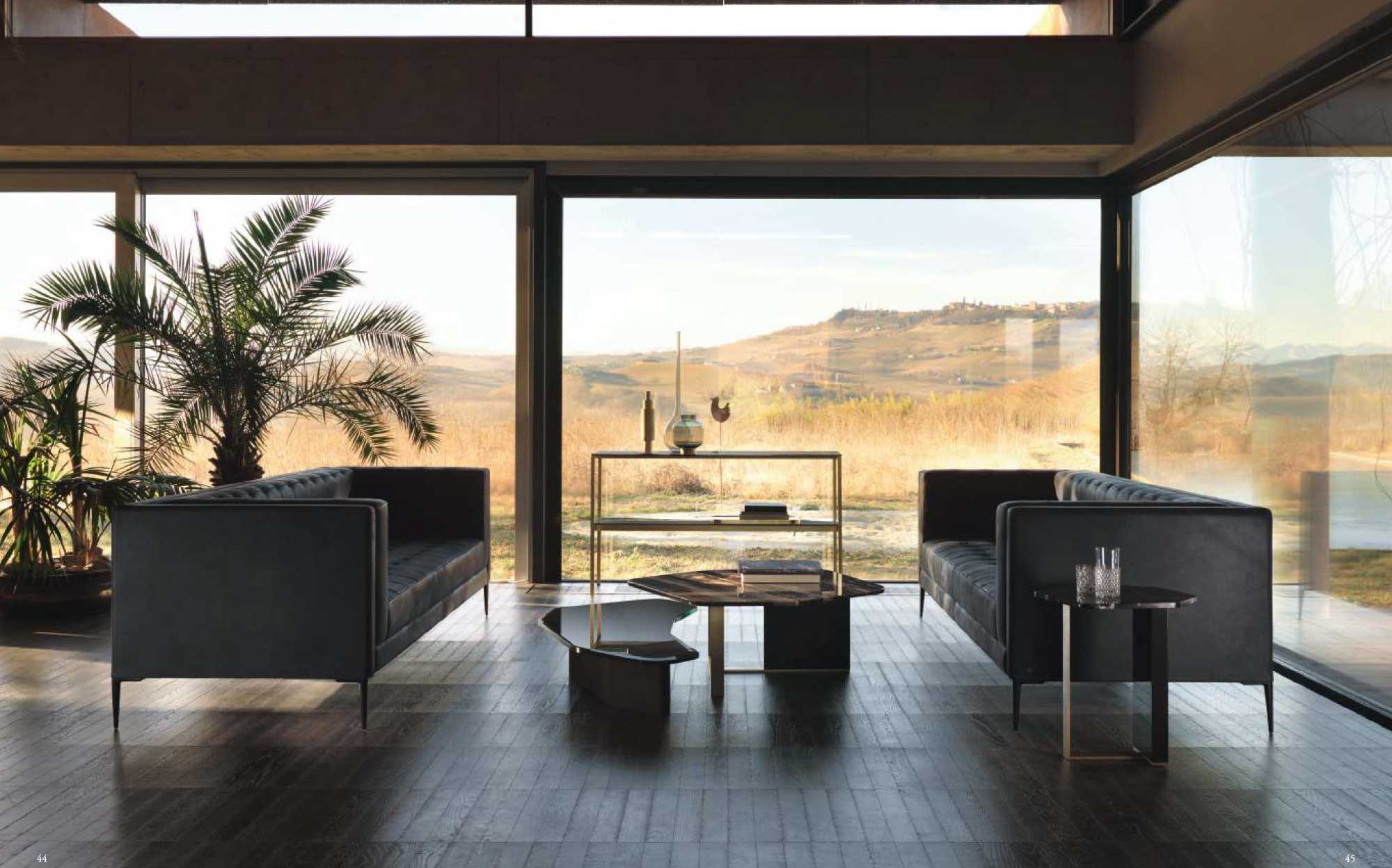 Daytona Home – Современный интерьер с видом на 101Domus Гостиная Daytona Home – Элегантные диваны и геометричные столики с панорамным видом